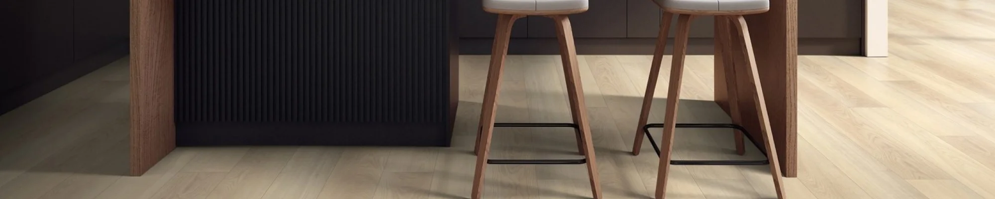 cascade top island and stools in modern kitchen with warm wood cabinets