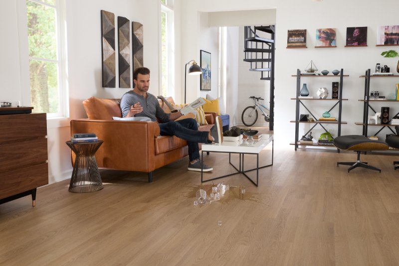 Spilling glass of water on a durable Pergo floor